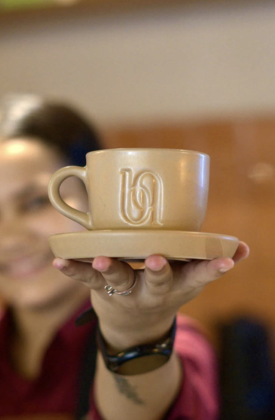 Custom embossed stoneware cup and saucer